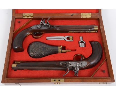 A pair of flintlock pistols, with 26 cm octagonal barrels, in a fitted case with accessories, 44.5 cm wide  See illustration 