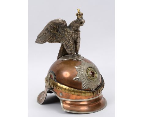 A Prussian Garde Du Corps Garde-Kurrassier-Regt officer's style helmet, with eagle finial and a sunburst crest surrounding a 