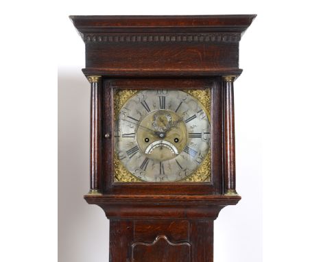 A longcase clock, the 27.5 cm square brass dial having a silvered chapter ring with Roman numerals, the engraved matt centre 