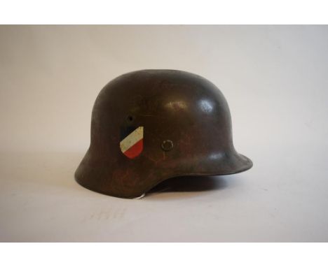 A German steel helmet, with double decals   Condition report  ReportAt base on helmet rear inside.  Serial No 3145.  May not 