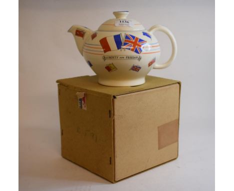 A Crown Ducal WWII souvenir teapot, decorated various allied national flags and motos, and inscribed War Against Hitlerism, T