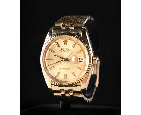 AN 18 CARAT GOLD ROLEX DATEJUST OYSTER PERPETUAL BRACELET WATCH the circular champagne dial with baton index and gilt hands, 