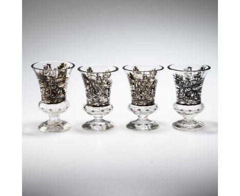 ATTRIBUTED TO JOSEF LENHARDT OF STEINSCHÖNAU, FOUR SCHWARZLOT GLASS GOBLETS c.1840, the deep bell-shaped bowls decorated with