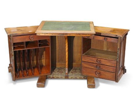 A VICTORIAN WALNUT 'WOOTON' DESK, BY T. SIMPSON &amp; SON OF HALIFAX, CIRCA 1870 the gilt-tooled leather lined hinged and rat