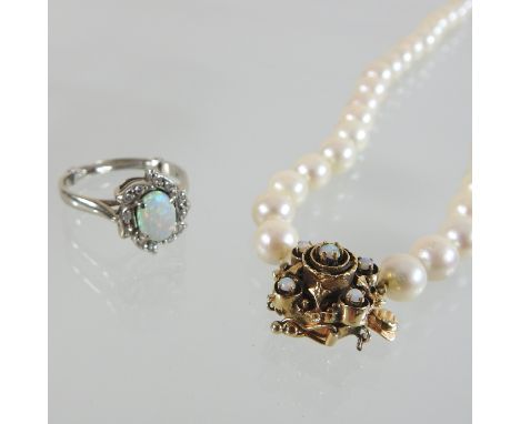 A 14 carat gold opal and diamond cluster ring, together with a cultured pearl single stand necklace, with a gilt and opal cla