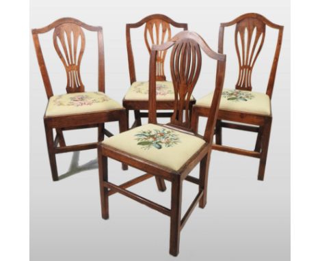 A set of four George III ash dining chairs, each having pierced splat, with an tapestry seat, on square legs