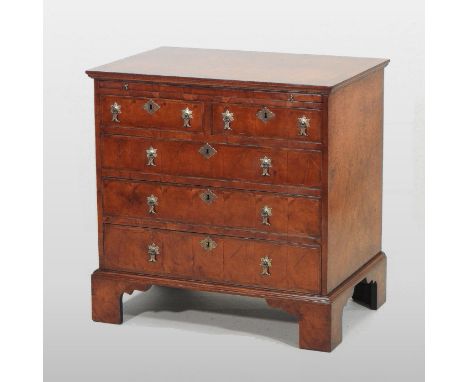 A William and Mary style oyster veneered and feather banded bachelor's chest, fitted with a brushing slide, containing two sh