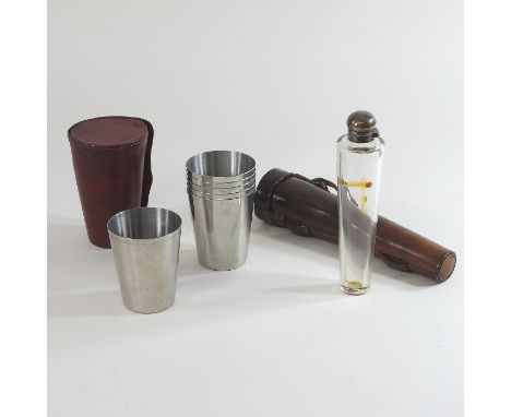 An early 20th century glass hunting flask, with a silver plated top, in a fitted leather case, 23cm, together with a set of b