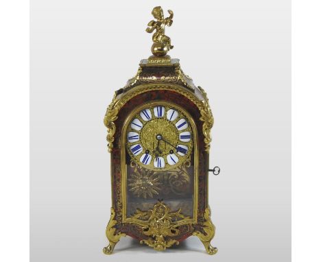 A 19th century Louis XIV style boulle work and ormolu mounted bracket clock, the scarlet tortoiseshell and cut brass case wit