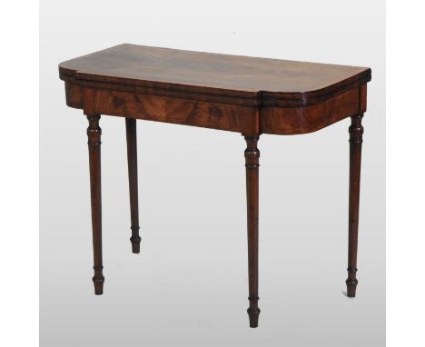 A George III mahogany and satinwood crossbanded folding card table, with a hinged breakfront top, on turned legs, 94cm