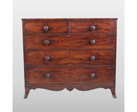 A George III mahogany chest, containing two short over three long graduated drawers, on swept bracket feet, 124cm