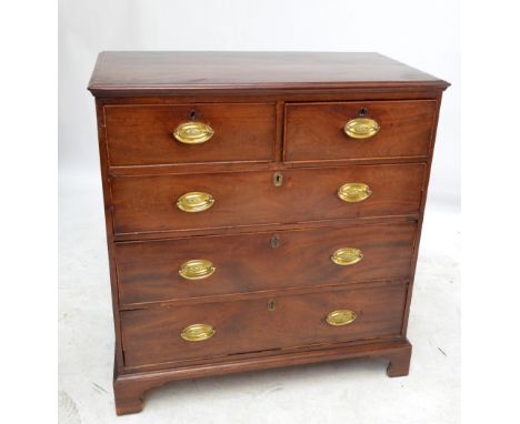 A Georgian mahogany chest of two short above three long drawers, with brass handles above bracket feet, width 96cm, height 10
