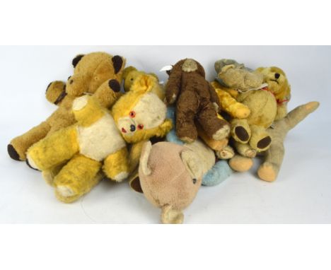 A collection of teddy bears to include a blonde Merrythought 'Ironbridge' mohair example with plastic eyes, stitched nose and