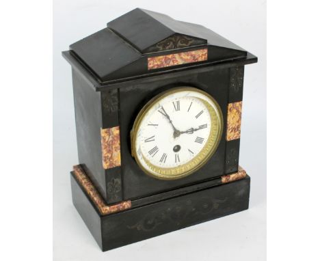 A 19th century black slate mantel clock, the circular dial set with Roman numerals (af), dial diameter 9cm, height 26cm. COND