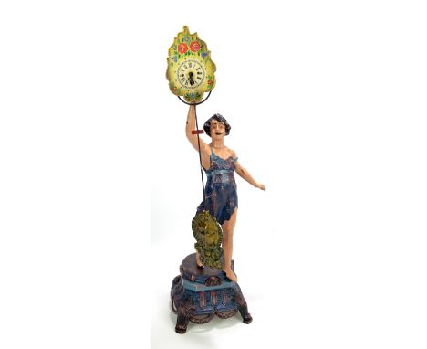 A reproduction painted cast iron figural mantel clock, the circular dial set with Roman numerals, on decorative base, height 