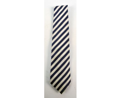 PAUL SMITH; a silk tie decorated with grey and navy blue diagonal stripes.
