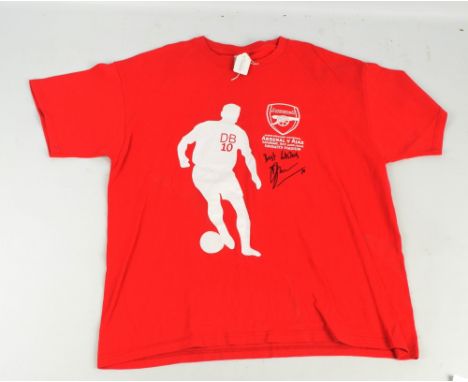 ARSENAL; a replica Dennis Bergkamp testimonial shirt signed by Dennis Bergkamp and inscribed 'Best Wishes'.