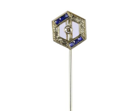 An 18ct white gold Art Deco stick pin of open hexagonal form centred with a round cut diamond, approx 0.06ct, and set with tw