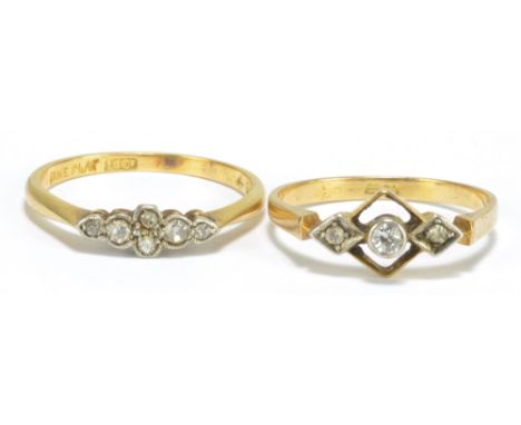 An 18ct yellow gold Art Deco style three stone diamond ring, the central stone approx 0.1ct, size M1/2, and a further example