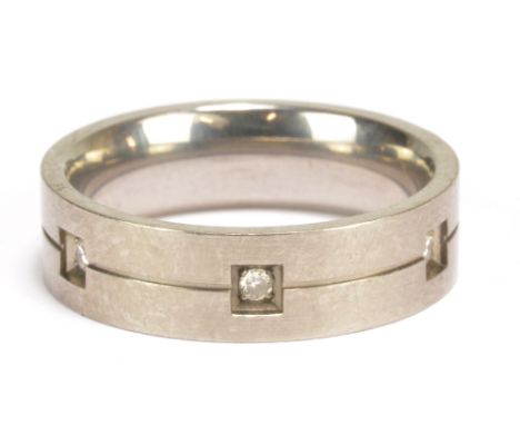 A titanium and diamond ring, size Q, approx 3g.