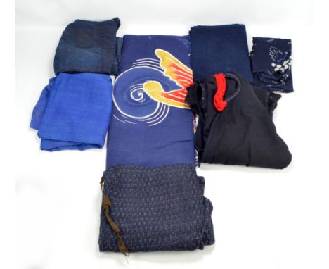A quantity of Japanese textiles including a nobori koi tsutsugaki, and indigo futonji.