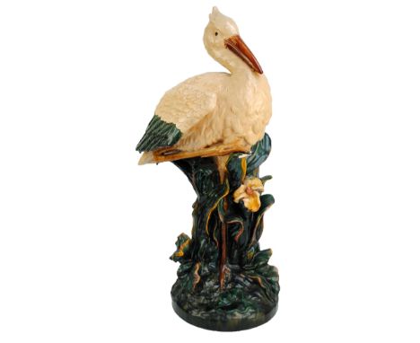 A circa 1900 Continental majolica glazed stick stand in the form of a stork, unmarked, height 94cm (af). CONDITION REPORT: Th