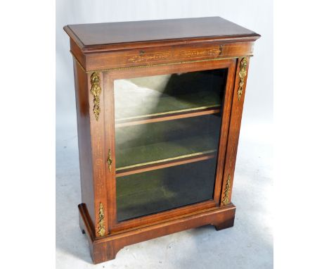 A Victorian walnut and inlaid pier display cabinet with single glazed door enclosing three shelves, with applied gilt metal o