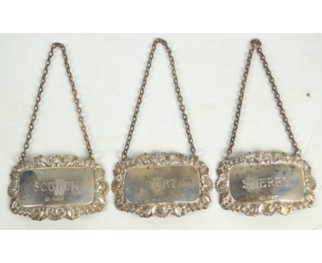 WILLIAMS ADAMS LTD; a pair of Elizabeth II hallmarked silver sherry and port decanter labels, Birmingham 1994, and a matching