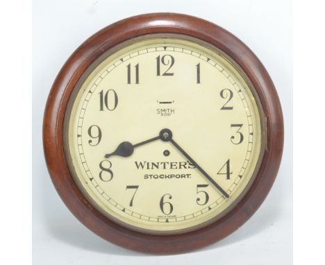 An early to mid-20th century Smith eight day wall clock, the circular dial set with Arabic numerals and further stamped 'Wint