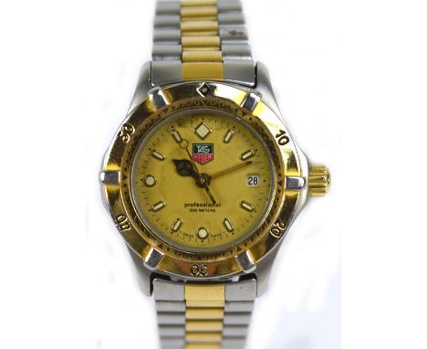 TAG HEUER; a stainless steel and gold plated lady's 'Professional' wrist watch with brick link bracelet, numbers Y26890 and W