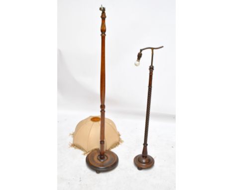 An early 20th century oak barleytwist standard reading lamp, height 122cm including brass fitment, and a further standard lam