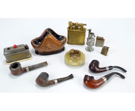 Four table lighters to include a brass Dunhill example, patent number 1343752, a green onyx example, two pocket lighters, als