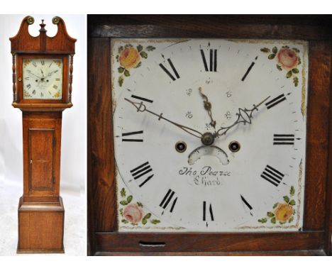 An early 19th century oak and mahogany crossbanded eight day longcase clock with broken swan neck pediment above painted dial