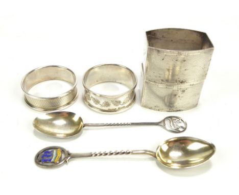 ADIE BROS LTD; a pair of George VI hallmarked silver Art Deco style napkin rings with overall engine turned decoration, Birmi