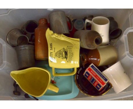 A quantity of predominantly ceramic pub ware including two Cutty Sark whisky advertising jugs, Johnnie Walker tray, Wheatley'