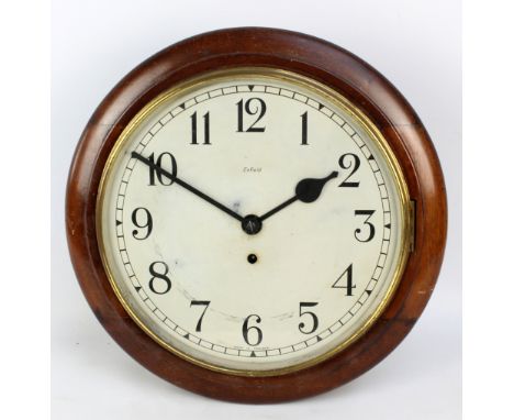 An Enfield wall clock, the circular dial set with Arabic numerals, dial diameter approx 29cm, total diameter approx 39cm. CON