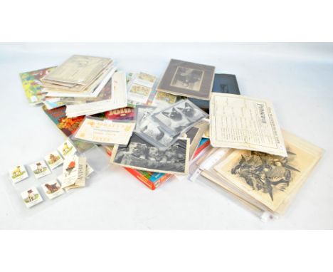 A quantity of juvenalia ephemera including German card stories illustrated with bunnies, drawing book of animals, a cloth boo