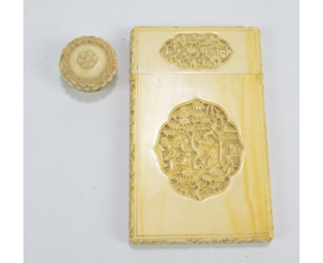 A late 19th/early 20th century Chinese canton ivory card case elaborately carved with four panels depicting figures amongst t