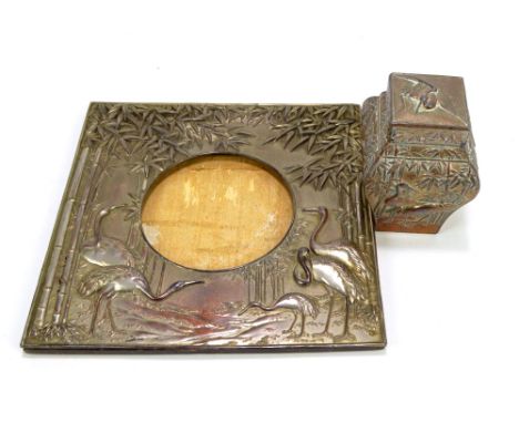 A 20th century Japanese white metal plated photo frame with circular aperture, diameter 10cm, and matching square baluster te