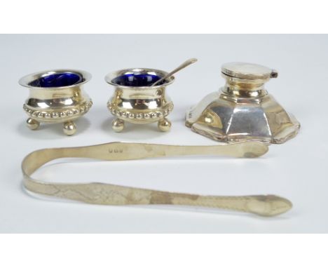 WILLIAMS (BIRMINGHAM) LTD; a George VI hallmarked silver inkwell with octagonal spreading lobed base, Birmingham 1945, a pair
