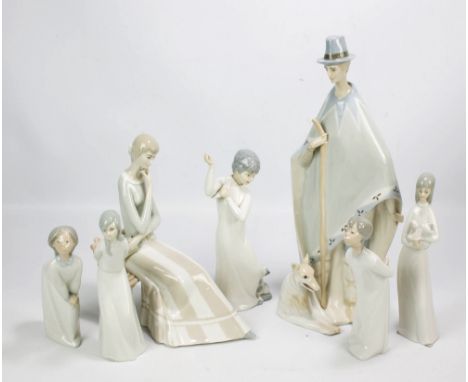 A Lladro figure of girl in nightgown, a similar Nao figure of a boy (af), two further Spanish porcelain figures by Miquel, tw