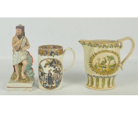 A late 18th century pearlware cylindrical mug clobbered transfer decorated with two figural oval panels and a floral band to 