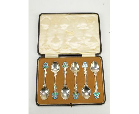 WILLIAM HUTTON & SONS LTD; a cased set of six Edward VII hallmarked silver Arts and Crafts style teaspoons with blue and gree