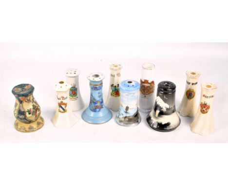A collection of ten ceramic hat pin holders including crested examples, examples with Oriental decoration, etc.