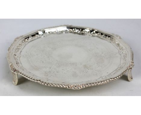 WILLIAM GIBSON; a Victorian hallmarked silver shaped circular salver with cast rope twist and foliate scroll decorated rim, c