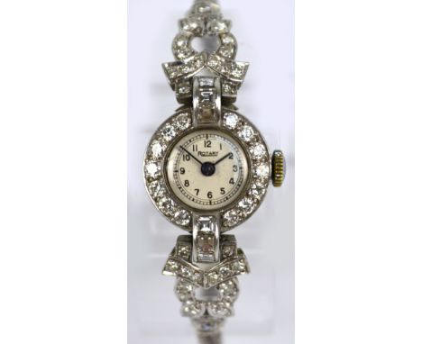 ROTARY; an Art Deco platinum and diamond manual wind lady's cocktail wristwatch, the circular dial set with Arabic numerals, 