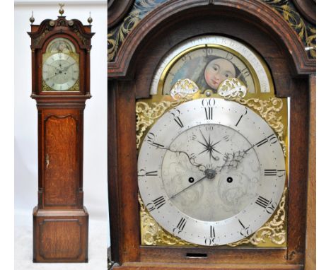 A late 18th century oak and mahogany crossbanded eight day longcase clock, the broken swan neck pediment above arched dial in