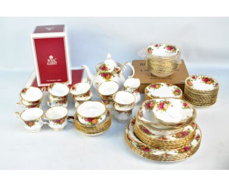 A Royal Albert 'Old Country Roses' pattern part tea service to include teapot, twelve cups and saucers, four serving plates a