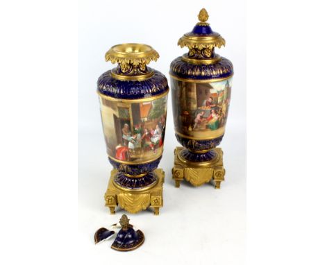 A pair of late 19th century French porcelain vases with covers, one painted with allegory of wealth depicting people feasting