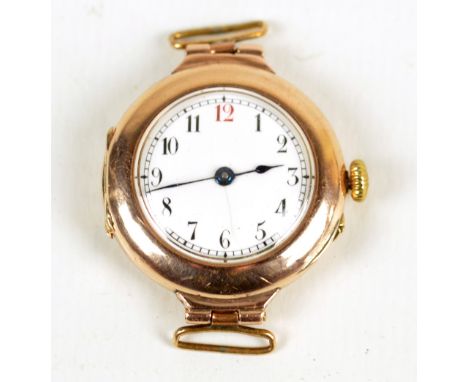 A 9ct yellow gold lady's wristwatch, the white circular enamel dial set with Arabic numerals, case inscribed 99TO8, diameter 